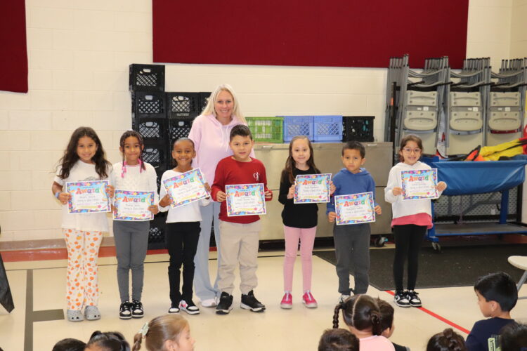 Mrs. Pufundt and her 2nd grade Honor Roll students.