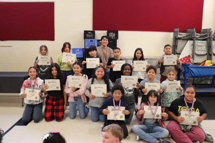 Mr. Hernandez (long term substitute for Mrs. Schmidt) and their 5th grade Honor Roll students.