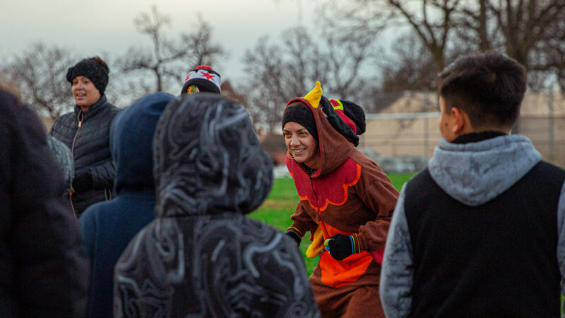 Mrs. Hills gets students pumped for the Turkey Trot!