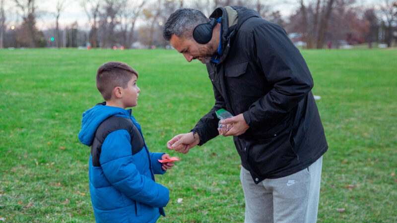 Mr. Contreras passes out special turkey token to students.