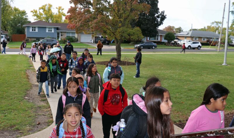 Students walking into the building